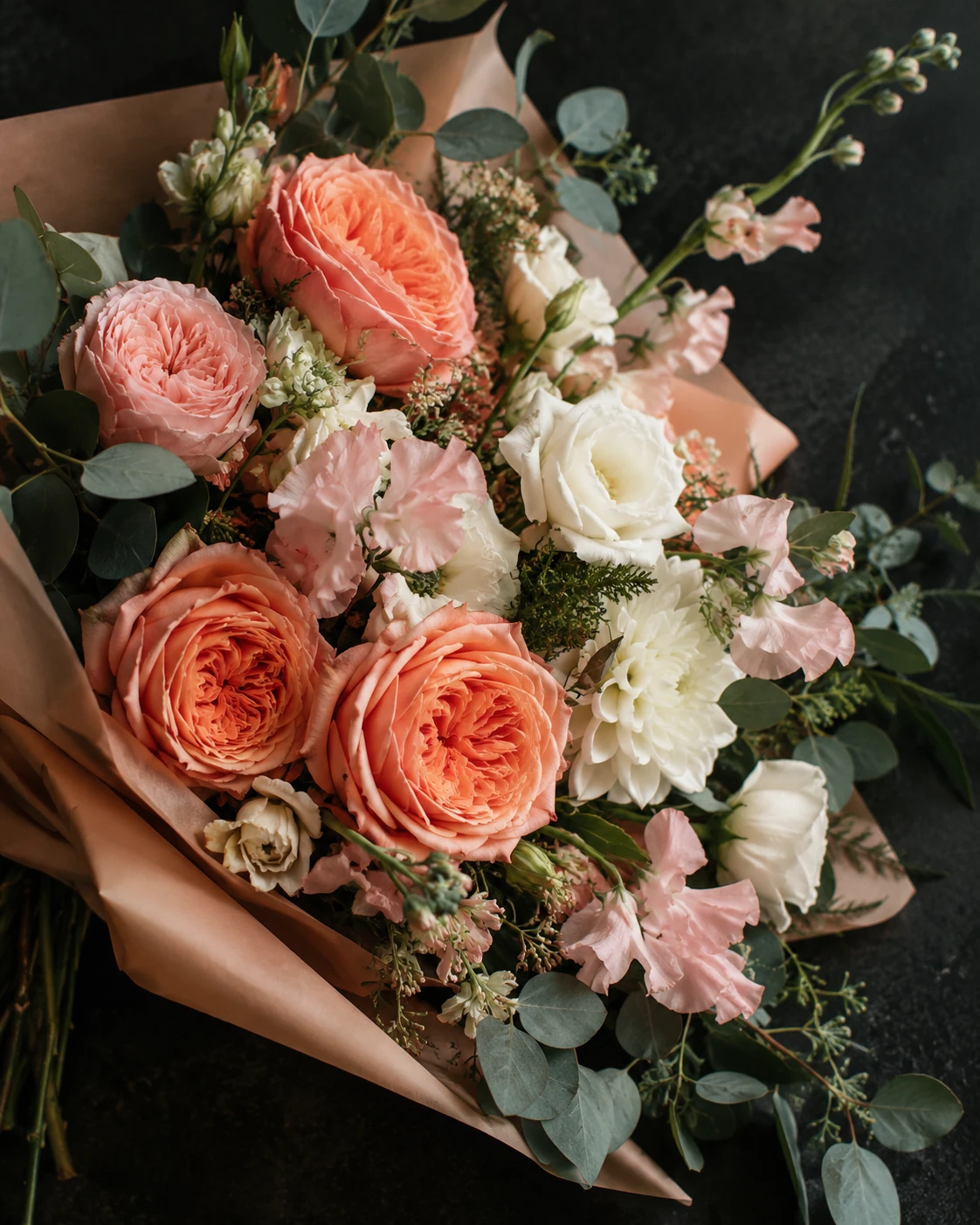 Illustrative botanical still life of coral, apricot, white and eucalyptus flowers; not a photograph of an exact Irene's Flower Market arrangement.